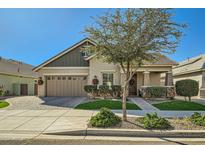 Charming curb appeal with stone accents and a welcoming front porch at 4341 E Evelyn St, Gilbert, AZ 85295