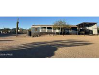 Ranch-style home with covered porch and large yard at 10120 E Mclellan Rd, Mesa, AZ 85207