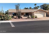 Single story home with desert landscaping and a two-car garage at 1522 Leisure World --, Mesa, AZ 85206