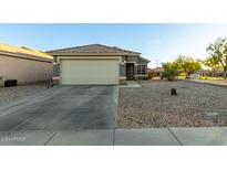 Single-story house with attached garage and desert landscaping at 22789 W Cantilever St, Buckeye, AZ 85326