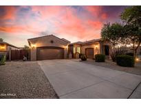 Beautiful desert landscape home with a two car garage and driveway at 3205 E Gemini Ct, Chandler, AZ 85249