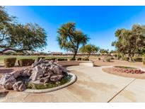 Relaxing water feature with seating area, located near a golf course at 14817 W Piccadilly Rd, Goodyear, AZ 85395