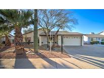 Single story home with desert landscaping and a two car garage at 2421 E Dragoon Ave, Mesa, AZ 85204