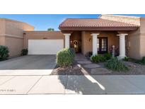 Spanish style home with a tiled roof, columns, and landscaping at 7825 E Granada Rd, Scottsdale, AZ 85257