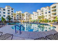 Resort-style pool and spa with surrounding patio and lounge chairs at 2511 W Queen Creek Rd # 340, Chandler, AZ 85248
