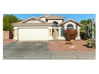 Attractive single-story home with a two-car garage and well-maintained landscaping at 13014 W Soledad St, El Mirage, AZ 85335