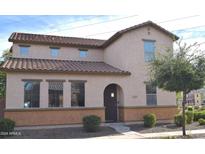 Two-story house with Spanish-style tile roof and landscaping at 7229 S 48Th Ln, Laveen, AZ 85339
