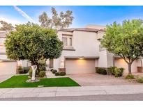 Attractive stucco home with two-car garage and lush landscaping at 7272 E Gainey Ranch Rd # 75, Scottsdale, AZ 85258