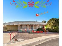 Ranch-style home with festive holiday decorations at 14228 N Sierra Dawn Way, Sun City, AZ 85351