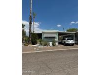 Mobile home exterior with carport and landscaping at 201 S Greenfield Rd # 333, Mesa, AZ 85206