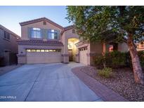 Inviting two-story home with a two-car garage and landscaped front yard at 23914 N 25Th Way, Phoenix, AZ 85024