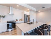 Modern kitchen with stainless steel appliances and white cabinetry at 3131 N Central Ave # 5022, Phoenix, AZ 85012