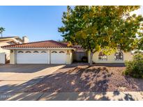 Single-story house with a two-car garage and desert landscaping at 3315 E Hampton Ave, Mesa, AZ 85204