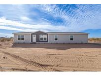 Single-story home with neutral siding and landscaping at 35041 W Euclid Ave, Tonopah, AZ 85354