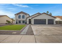 Beautiful two-story home with a landscaped lawn, two-car garage, and attractive curb appeal at 1418 S Almar Cir, Mesa, AZ 85204