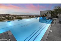 Stunning rooftop pool with city views and lounge chairs at 7180 E Kierland Blvd # 311, Scottsdale, AZ 85254