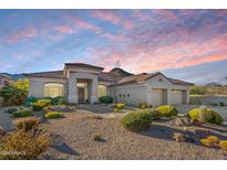 Single-story home with desert landscaping and two-car garage at 11917 E Mariposa Grande Dr, Scottsdale, AZ 85255