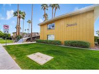 Building exterior showing mid-century modern architecture, landscaping, and a walkway at 6805 E 2Nd St # 4, Scottsdale, AZ 85251