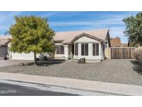 Single-story home with a landscaped front yard and a two-car garage at 6522 E Fox St, Mesa, AZ 85205