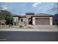 Single-story home with stone accents and a two-car garage at 26392 W Abraham Ln, Buckeye, AZ 85396