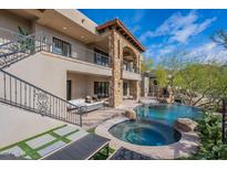 Luxury backyard with pool, spa, and seating area at 11328 E Dreyfus Ave, Scottsdale, AZ 85259