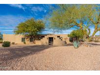 Spanish style home with landscaped front yard and gated entry at 12550 E Silver Spur St, Scottsdale, AZ 85259