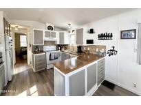 Functional kitchen with a peninsula, modern appliances, and plenty of storage at 99 S Kaoline Dr, Apache Junction, AZ 85119