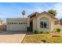 Charming single-story home with a tile roof, attached garage, and landscaped front yard at 1213 W Seascape Ct, Gilbert, AZ 85233