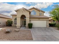 Inviting two-story home with a paved driveway and desert landscaping at 14039 N 13Th St, Phoenix, AZ 85022