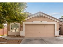 Charming single-story home with attached two-car garage at 12817 W Crocus Dr, El Mirage, AZ 85335