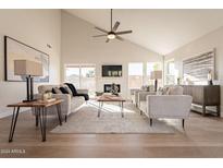 Open and bright living room with high ceilings, modern furniture, and large windows at 16030 S 32Nd Pl, Phoenix, AZ 85048