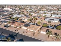 Aerial view of single-level home with solar panels and desert landscaping at 12422 W Ginger Dr, Sun City West, AZ 85375