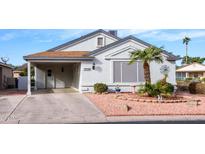 Charming single-story home with desert landscaping and covered carport at 1932 E Buena Vista Dr, Chandler, AZ 85249