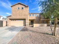 Two-story home with attached two-car garage and landscaped front yard at 3636 E Stampede Dr, Gilbert, AZ 85297