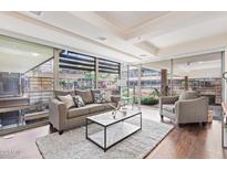 Inviting living room with large windows, comfortable seating, and stylish decor at 7151 E Rancho Vista Dr # 4001, Scottsdale, AZ 85251