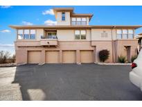 Attractive three-story building with four garages and a landscaped area at 19777 N 76Th St # 1248, Scottsdale, AZ 85255