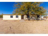 Single-story home with a large front yard and desert landscaping at 1430 W Maddock Rd, Phoenix, AZ 85086