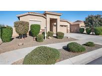 Inviting single-story home with a well-maintained front yard and desert landscaping at 21504 E Pecan Ct, Queen Creek, AZ 85142