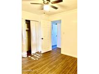 Bright bedroom with tile flooring, closet, and ceiling fan at 4401 N 12Th St # 110, Phoenix, AZ 85014