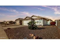 One-story house with a two-car garage and desert landscaping at 10380 W Potter Dr, Peoria, AZ 85382