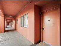 Exterior hallway leading to the front door of the unit at 4303 E Cactus Rd # 146B, Phoenix, AZ 85032