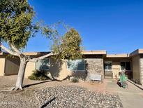 Inviting exterior of a single-story home with landscaping and a walkway at 11012 W Thunderbird W Blvd, Sun City, AZ 85351