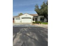 Single-story home with attached garage and landscaping at 1184 E Prescott Pl, Chandler, AZ 85249