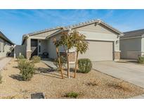 One-story home with a two-car garage and desert landscaping at 17352 W Country Club Ter, Surprise, AZ 85387