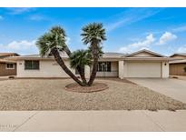 Single-story home with attractive landscaping and a two-car garage at 17624 N Lindgren Ave, Sun City, AZ 85373