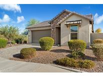 Single-story home with stone accents and a two-car garage at 29007 N 120Th Dr, Peoria, AZ 85383