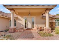 Brick entryway with columns and a glass front door at 942 N Miramar --, Mesa, AZ 85213