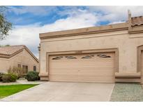 Attached garage with a double-door, providing ample parking and storage at 19522 N 84Th Ave, Peoria, AZ 85382