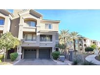 Two-story townhome with two-car garage and front yard landscaping at 4465 E Paradise Village S Pkwy # 1191, Phoenix, AZ 85032