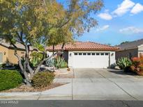 Single-story home with a two-car garage and desert landscaping at 3926 E Potter Dr, Phoenix, AZ 85050